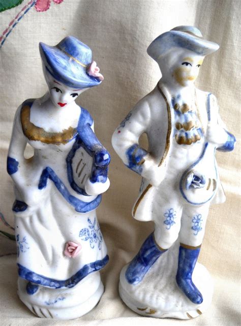 white and blue porcelain figurines